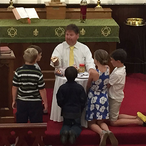 pastor-with-children